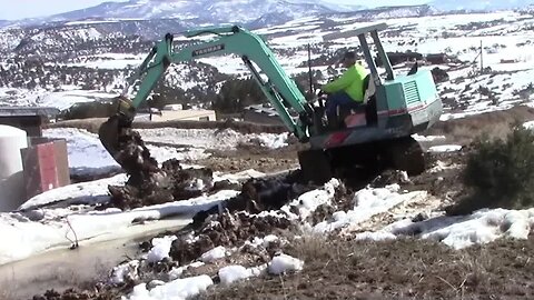 Yanmar YB 451 Digging A Flood Ditch