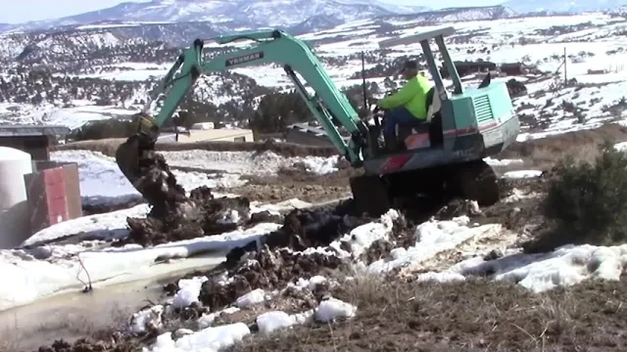 Yanmar YB 451 Digging A Flood Ditch