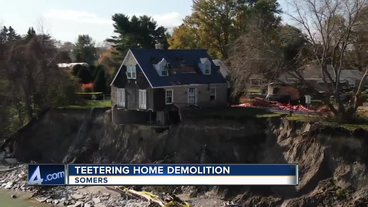 Demolition begins on Somers home teetering on edge of Lake Michigan
