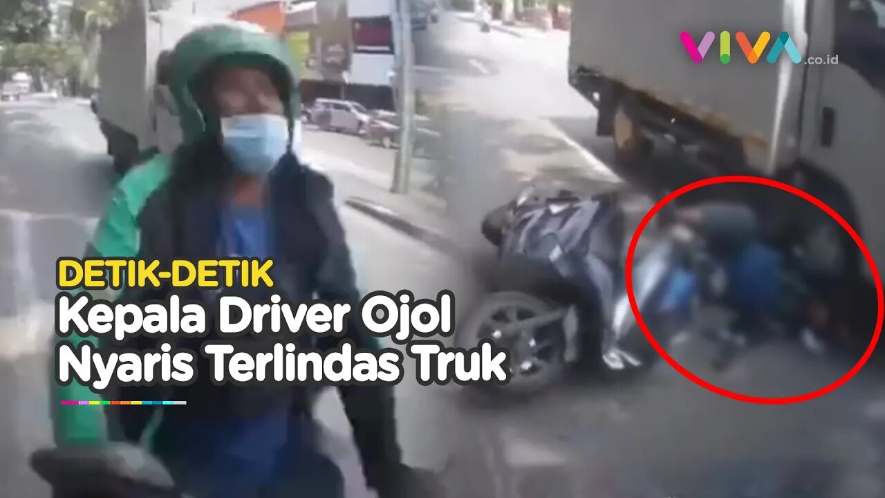 NGERI! Main HP Saat Berkendara, Kepala Driver Ojol Nyaris Terlindas Truk