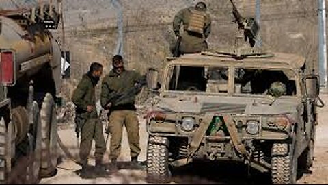 Israeli military vehicles move inside the Golan Heights buffer zone bordering Syria