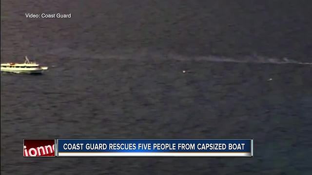 Coast Guard rescues 5 people from capsized boat