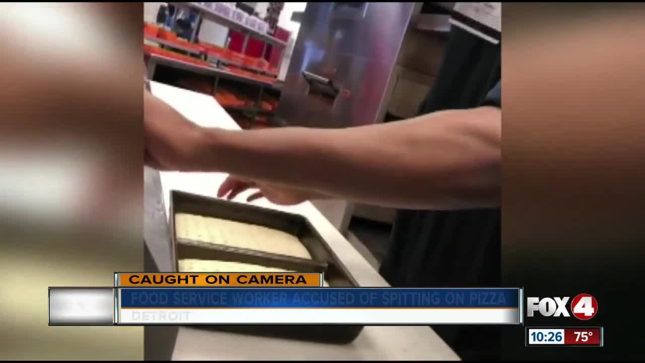 Worker caught on camera spitting on pizza