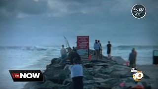 Two rescued after sailboat crashes into Ocean Beach jetty, sinks