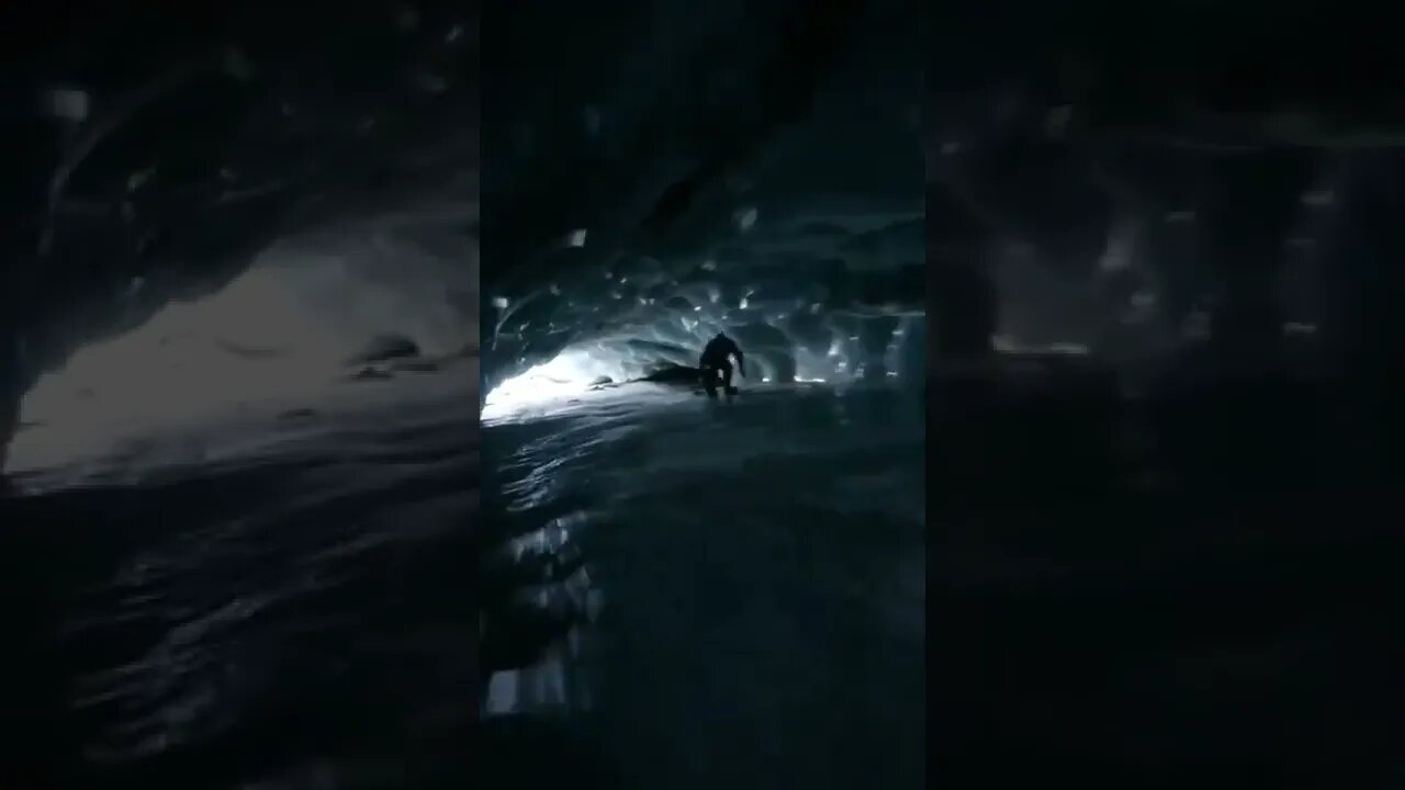 Snowboarding through ice tunnel