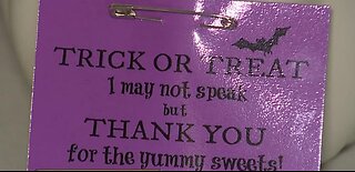 Teacher makes Halloween sign for non-verbal student