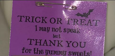 Teacher makes Halloween sign for non-verbal student