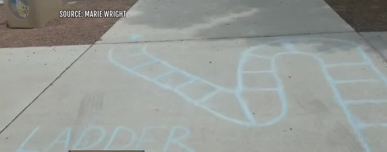 P.E. teachers draw chalk games for kids