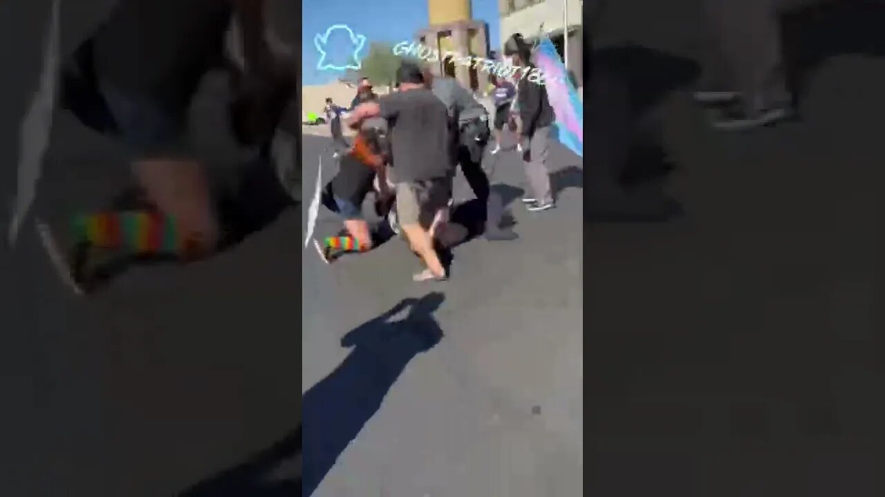 Fight breaks out between protesters and parents taking their kids to a drag show.