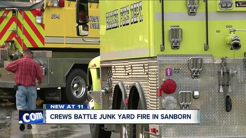 Firefighters battle scrap fire on Chew Road in Sanborn