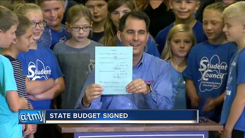 Walker makes statement on education with budget signing