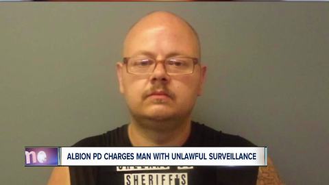 Albion man charged with unlawful surveillance