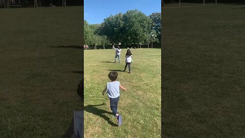 Green huge football field in the park-my kids are running on it