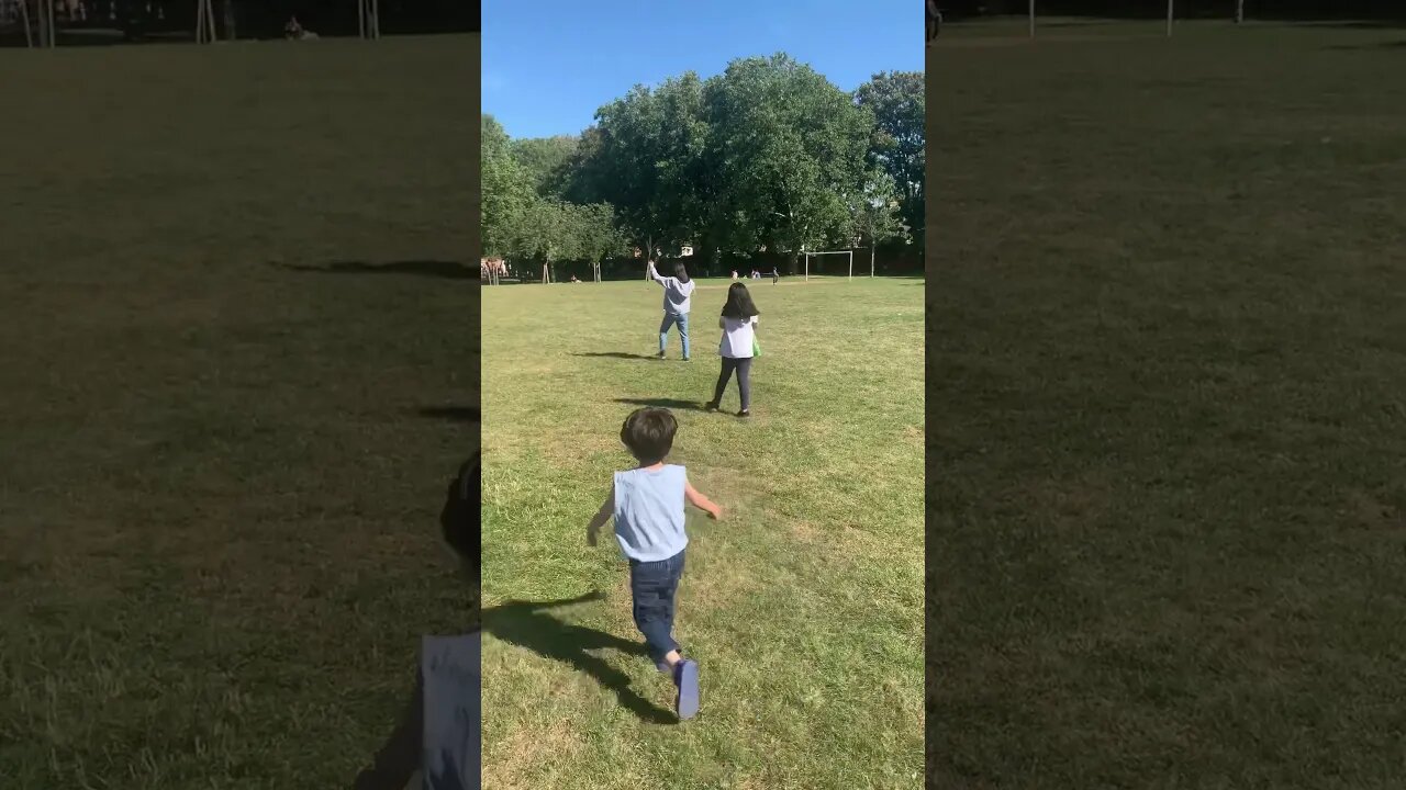 Green huge football field in the park-my kids are running on it