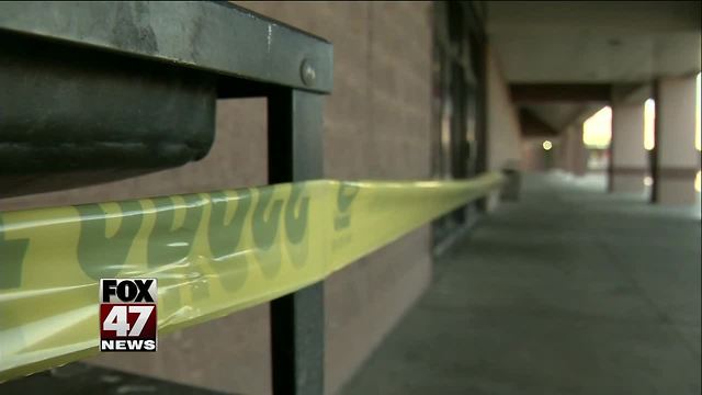 Woman arrested after co-worker slain in department store