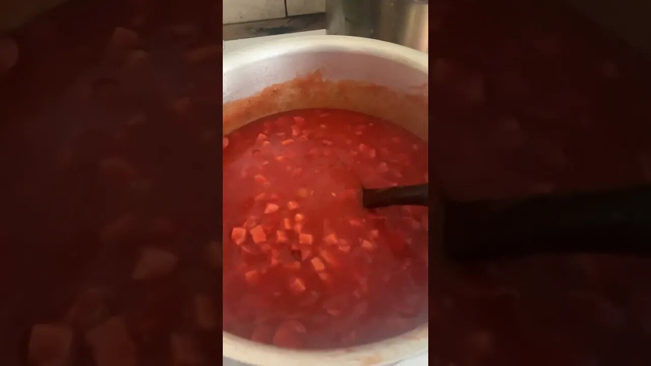 Getting ready the sauce spaghetti and sausages for Filipino spaghetti