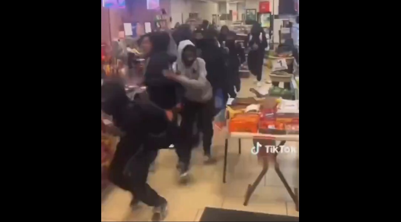 Black Mob Loots A Store - Don't Know Where, It Doesn't Matter