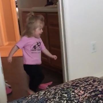 Little Girl Is Running After His Dad But Runs Into Wall