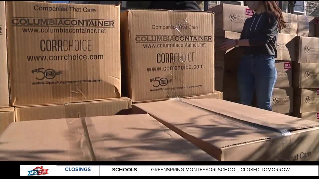Volunteers pass out 300 boxes to Baltimore families