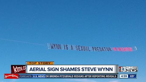 Woman's advocacy group flies banner reading "Wynn is a Sexual Predator"