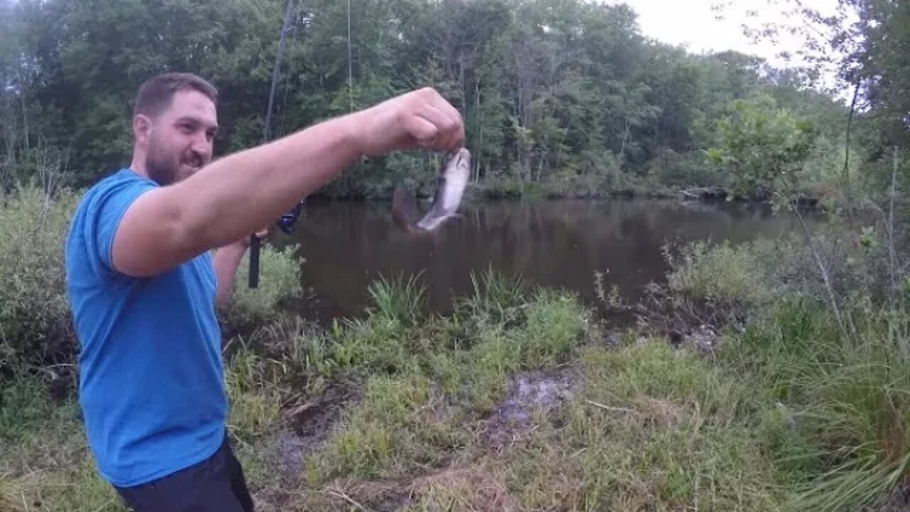 Fishing a pond during a thunderstorm