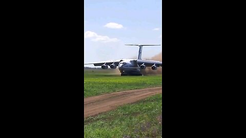 Landing of an Ilyushin Il-76 transport plane from a grass runway.
