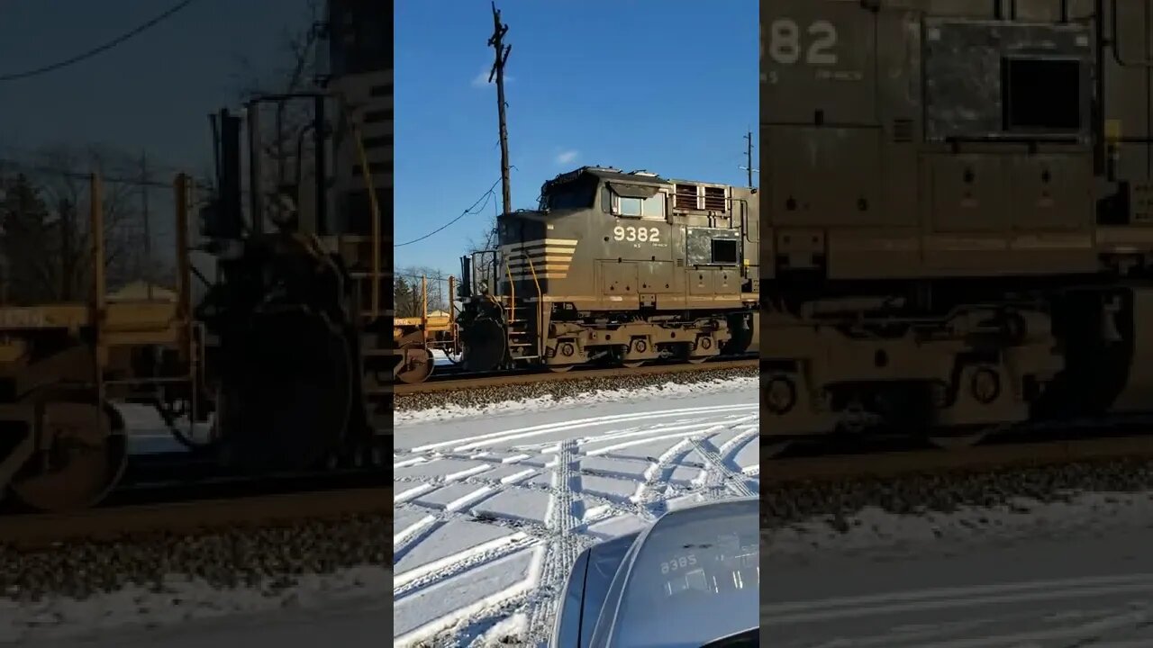 Open coil car on a snowy drive by