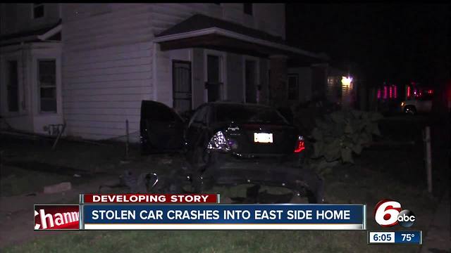 Stolen car crashes into multiple homes, bursts into flames after police chase