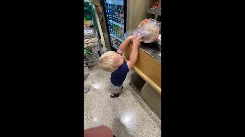 Toddler Helps Mommy With The Groceries