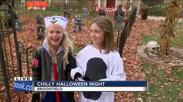 Trick-or-treaters bundle up for chilly Halloween