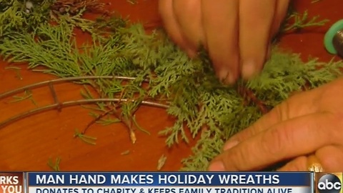 Man hand makes wreaths for Christmas