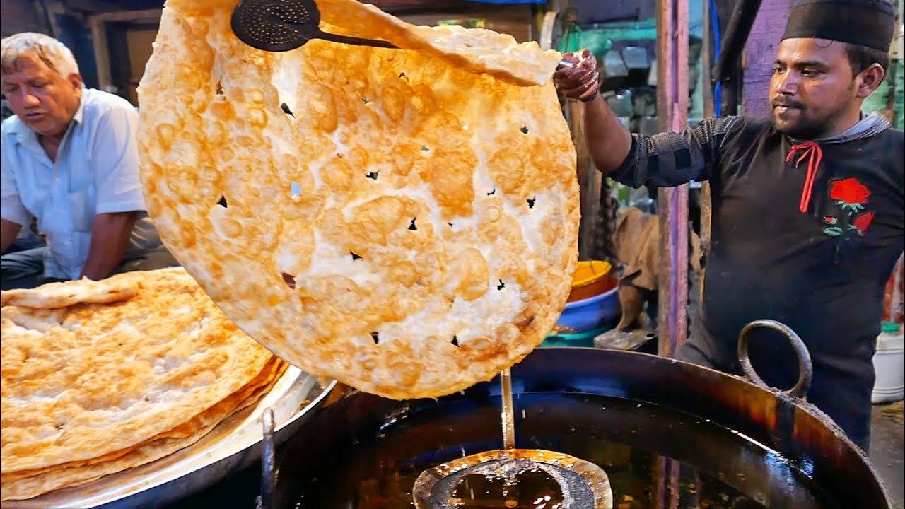 Indian street food - Srinagar Kashmir Indian giant roti paratha and halwa