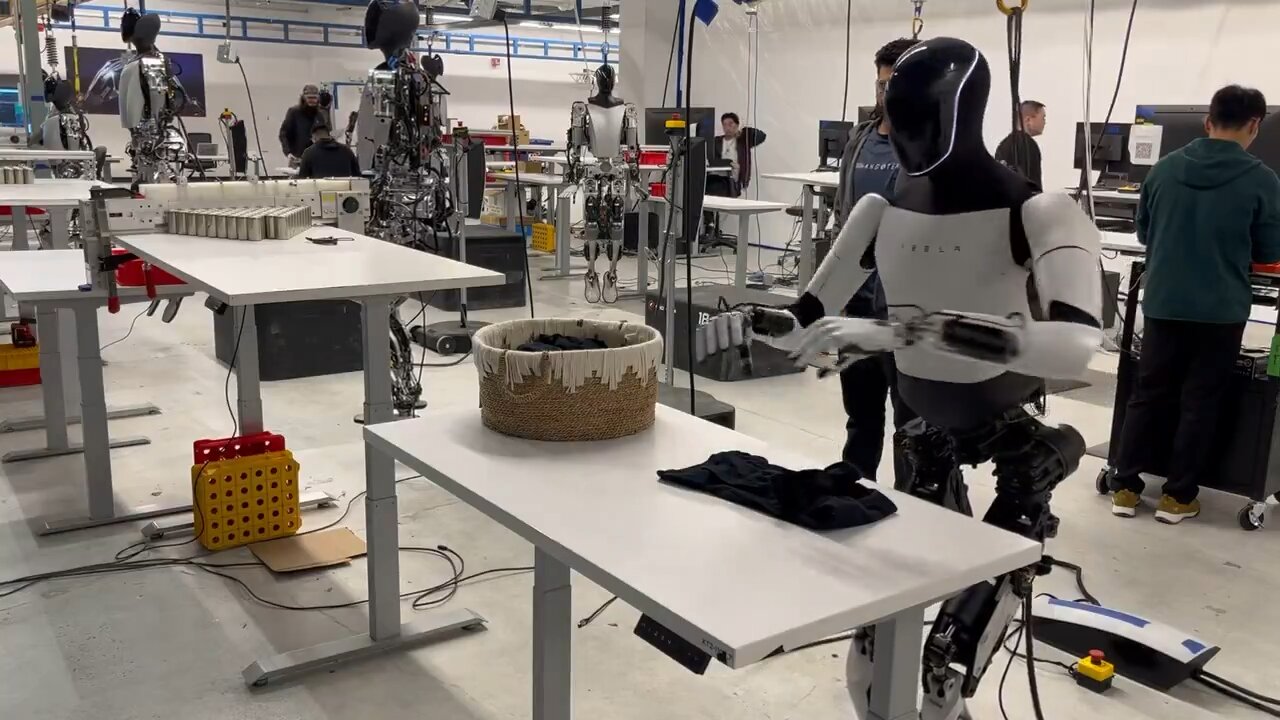 Musk has announced on X that Tesla's Optimus robot has now acquired the capability to fold shirts.
