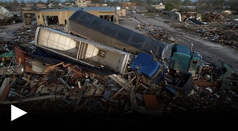 Trucks piled on buildings as tornado hits Mississippi