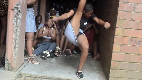 ZULU GIRL DANCES IN A LIGHT BLUE-GREY MINISKIRT