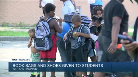 Shows and book bags giveaway for students