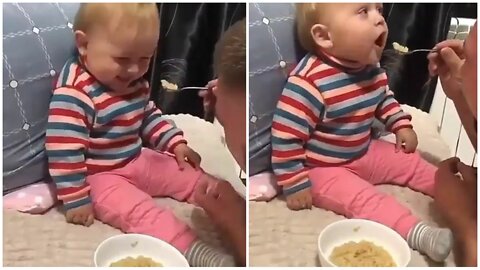 Father playing with his child on the eating plate