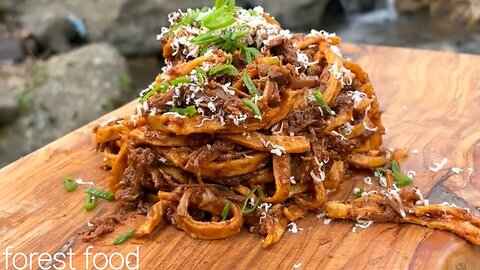 Delicious pasta with meat on fire