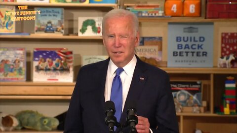 Look at those "Build Back Better" posters everywhere in the room.