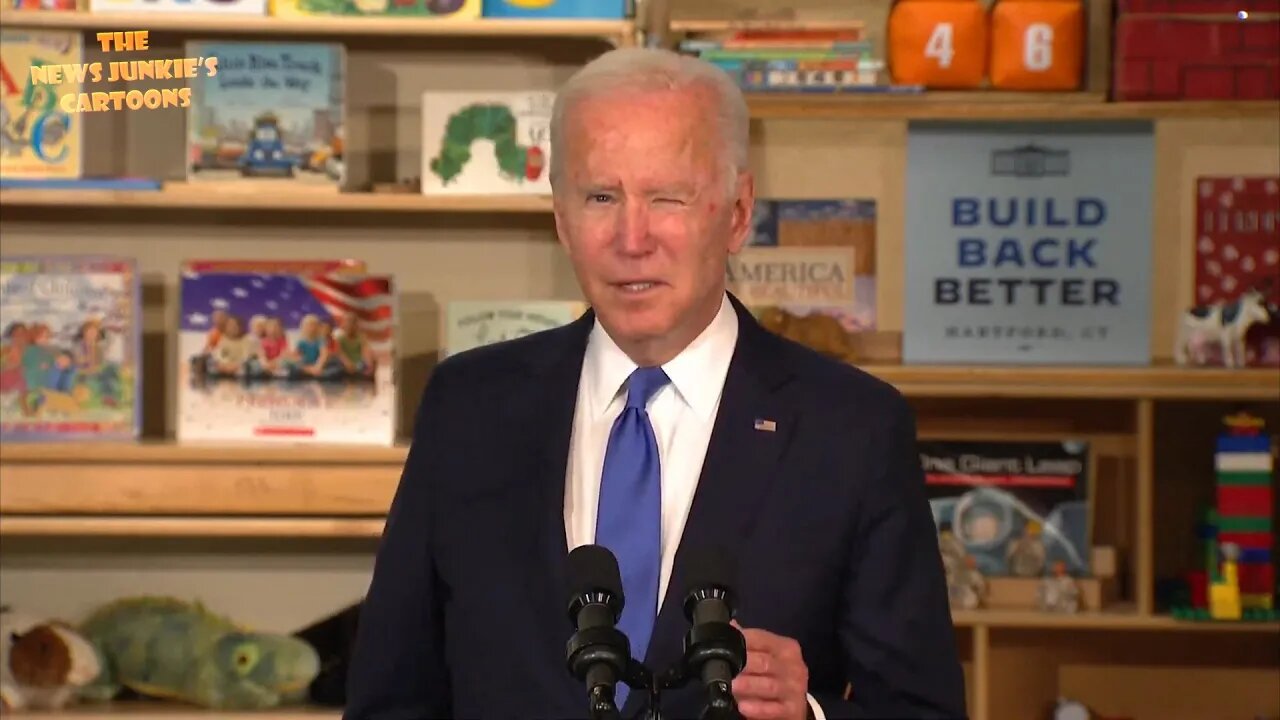 Look at those "Build Back Better" posters everywhere in the room.