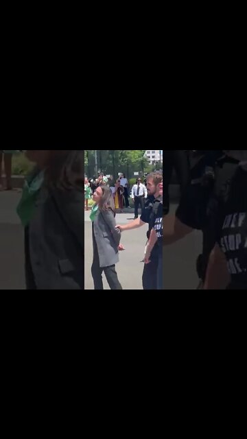 AOC pretends to be handcuffed as she's escorted away from SCOTUS by police