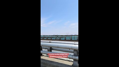 ...crossing a bridge in Incheon, South Korea, June 24
