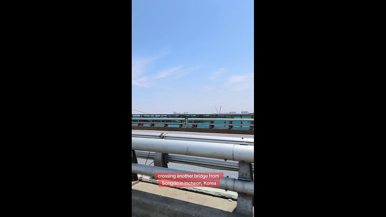 ...crossing a bridge in Incheon, South Korea, June 24