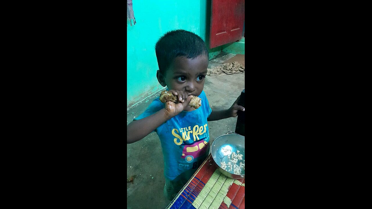 This child loves to eat chicken leg piece