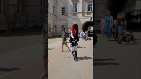 Wake way for the Queen's Guard.The young boy is almost walked in too