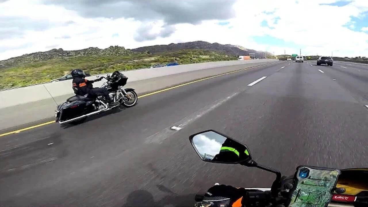 4K Video Harley Rider gives peace sign to Sport Bike rider