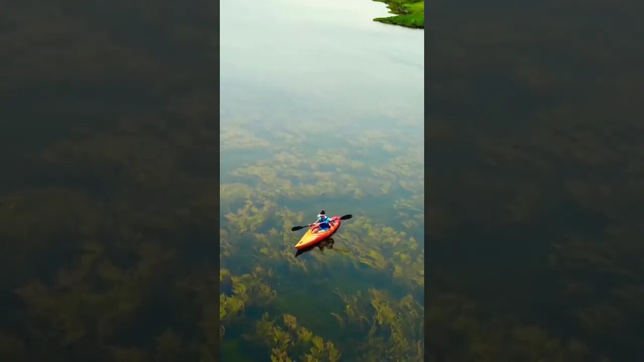 Drone shot of kayak in the river