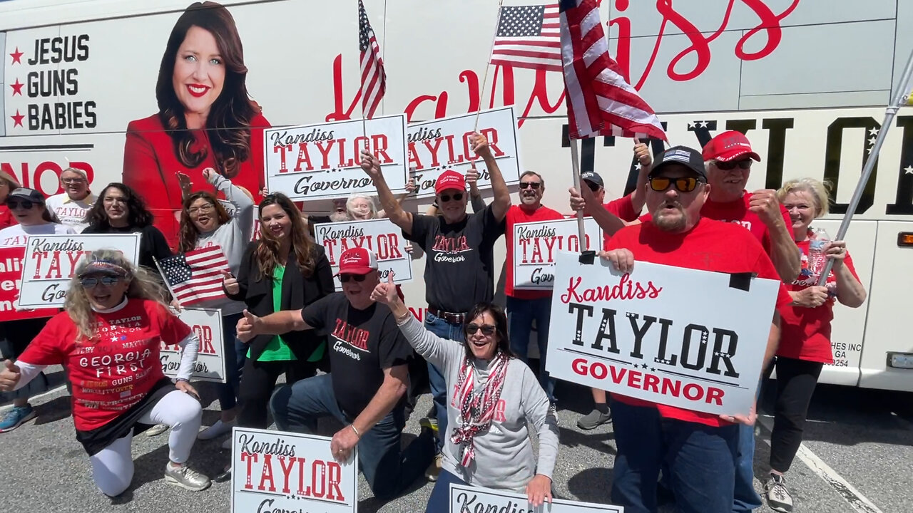 Kandiss Taylor Sign Waving Bus Tour