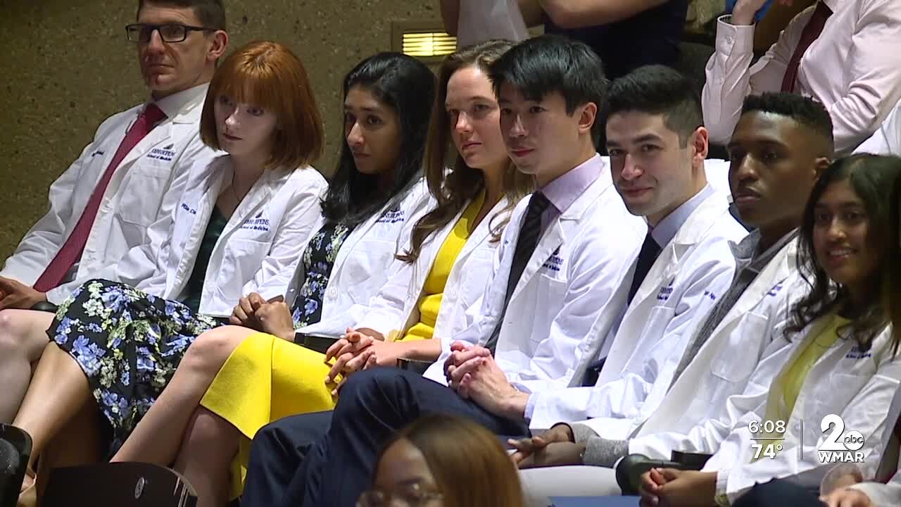 Johns Hopkins presented students with white coats to symbolize transition