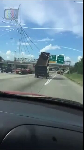 Driver Witnesses Dump Truck Crash Into Highway Sign in Jacinto City, TEXAS